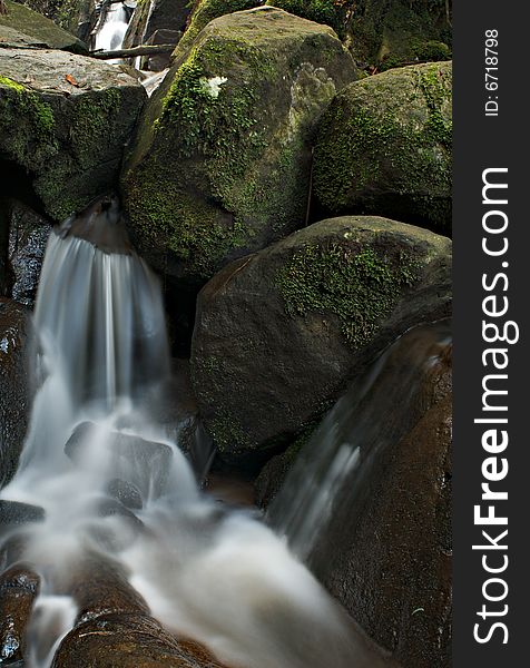 Clean and pure water cascading down a mountain stream