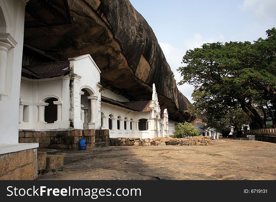 At the top of a mountain in Sri Lanka you find a Temple carved into the side. At the top of a mountain in Sri Lanka you find a Temple carved into the side.
