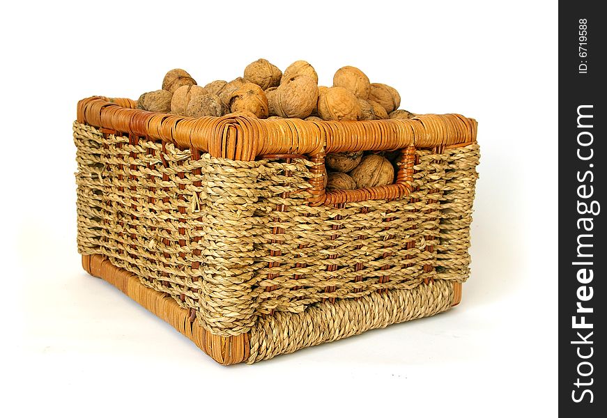 Basket of nuts on white background