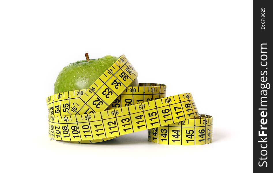 Green apple and tape measure isolared on white. Green apple and tape measure isolared on white