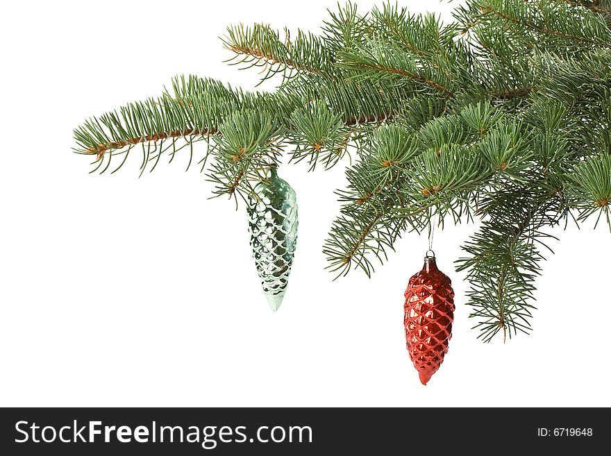 Fir tree branch with decoration on a white background. Close up. Christmas decoration.