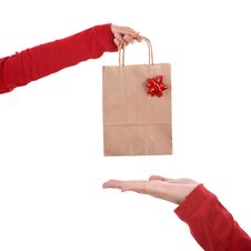 Woman Hand Holding Papper Bag With Red Ribbon Royalty Free Stock Image