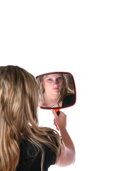 Pretty Woman Reflected In A Hand Mirror Stock Image