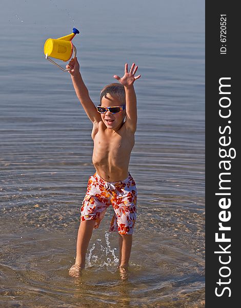 Boy Carrying  Waterbucket