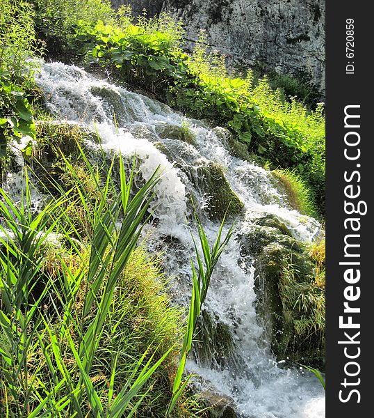 Fast stream. Croatia. Summer. Plitvitsky lakes. Splashes.