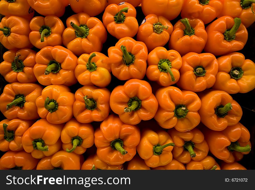 Display of rows of stacked red peppers