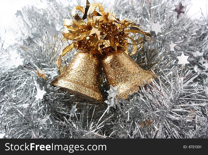 Christmas hand bells in a celebratory tinsel. Christmas hand bells in a celebratory tinsel