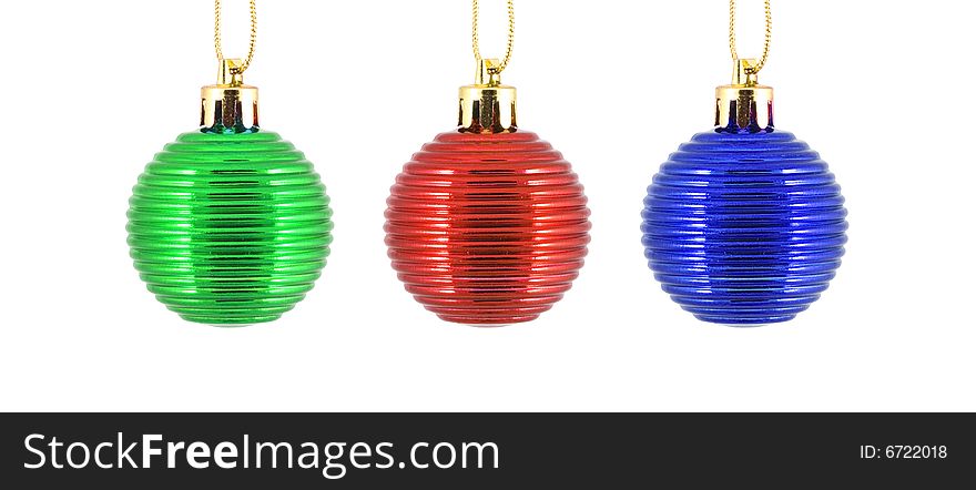 Trio christmas ornaments in blue, red and green - close up. Trio christmas ornaments in blue, red and green - close up