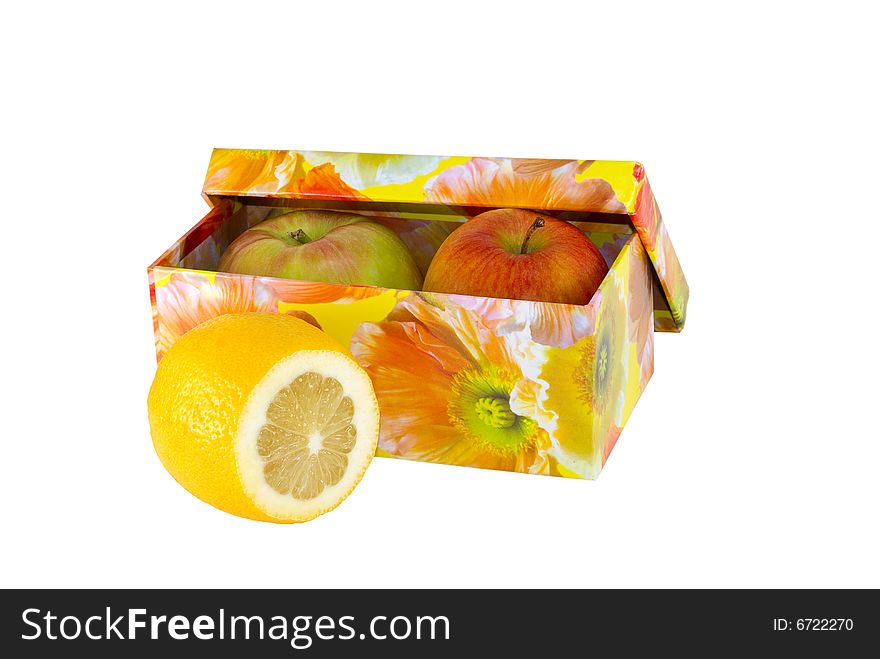 Limon and apples in a box on a white background. Limon and apples in a box on a white background