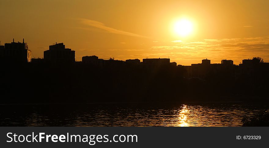 Silhouette of city in sunset