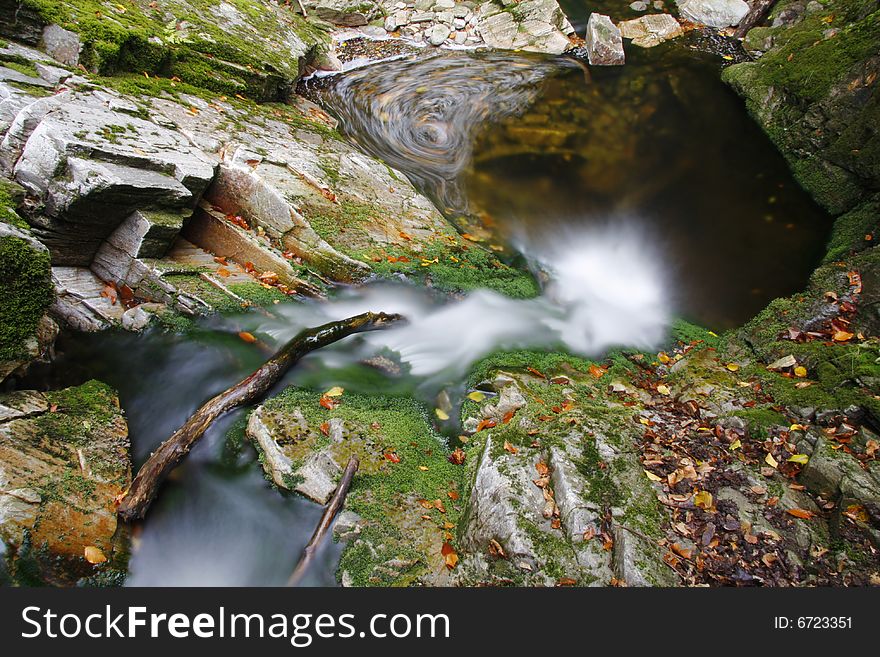 Mountain stream with mossy stones