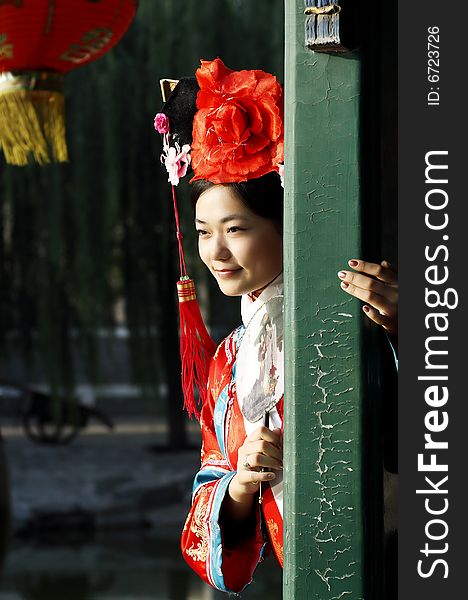 A beautiful girl in Chinese ancient dress is in the royal garden. This is dress of Qing Dynasty of China. It is the princess' dress too. Chinese on the fan is meant and missed. A beautiful girl in Chinese ancient dress is in the royal garden. This is dress of Qing Dynasty of China. It is the princess' dress too. Chinese on the fan is meant and missed.