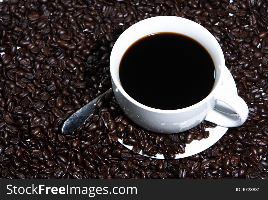 A cup of coffee on a white background. A cup of coffee on a white background