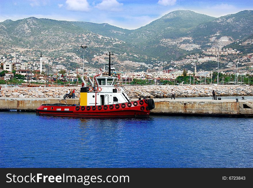 Harbor in turkey with red ship