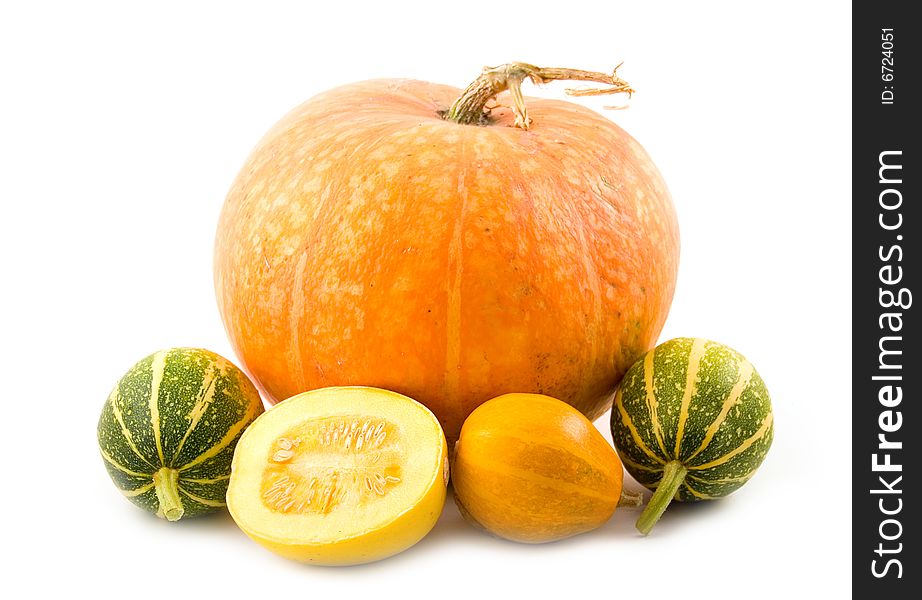 Decorative green and orange pumpkins with beautiful tasty pumpkin on  white background