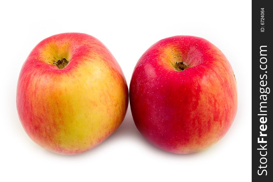 Ripe juicy beautiful and useful apples of plant going fruit on white background. Ripe juicy beautiful and useful apples of plant going fruit on white background