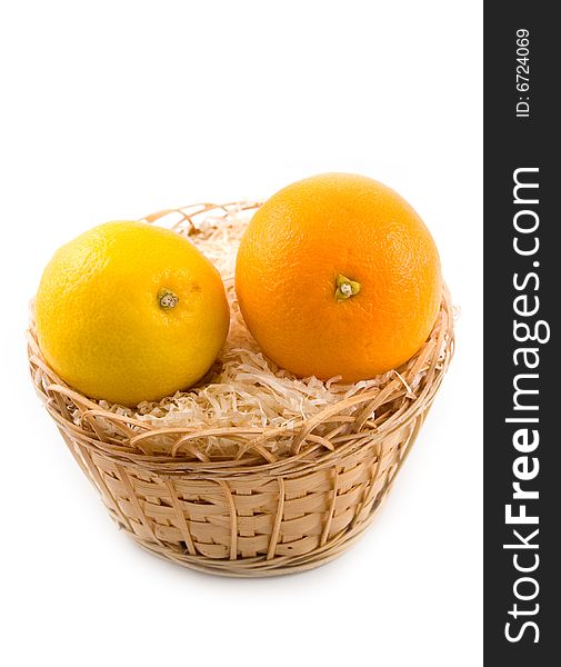 Plant tasty and useful orange with yellow beautiful lemon in basket on white background