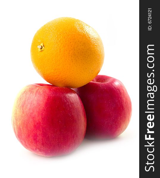 Sweet tasty useful orange on red beautiful apples with white background. Sweet tasty useful orange on red beautiful apples with white background