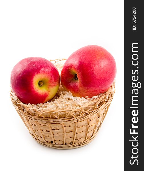 Ripe tasty and beautiful apples in yellow basket on white background. Ripe tasty and beautiful apples in yellow basket on white background