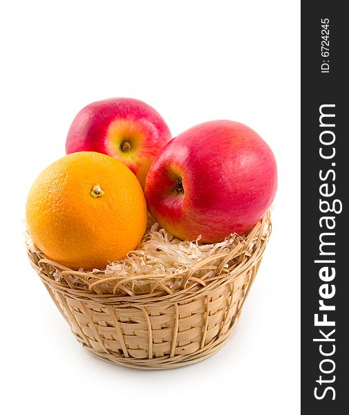 Ripe tasty useful fruit orange and apples on white background