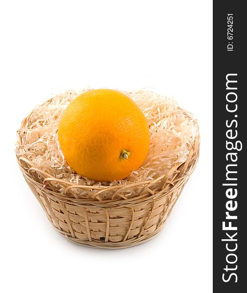 Tasty sweet and useful fruit orange in ellow basket on white background. Tasty sweet and useful fruit orange in ellow basket on white background