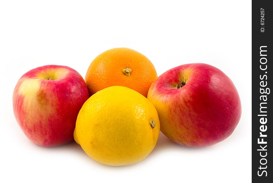 Beautiful and useful fruit orange red apples and yellow lemon on white background. Beautiful and useful fruit orange red apples and yellow lemon on white background