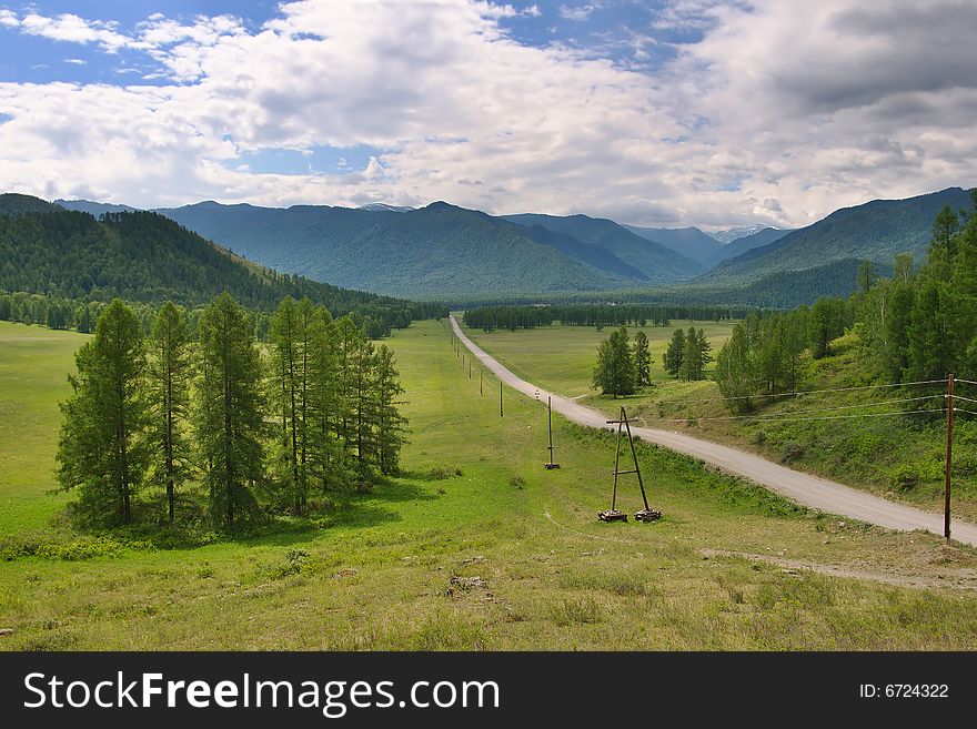 Rural road in mountains landscape