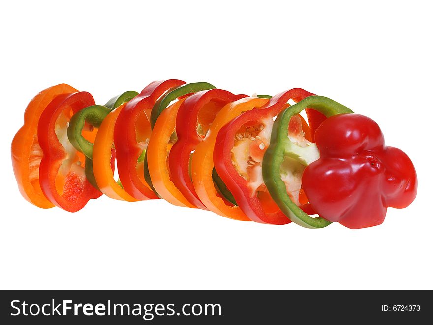 Sliced colorful peppers isolated on white background