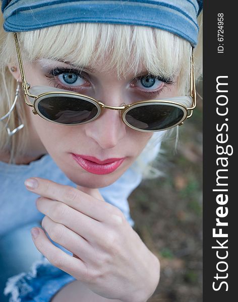 Portrait of a nice blue eyed girl wearing sunglasses. Portrait of a nice blue eyed girl wearing sunglasses