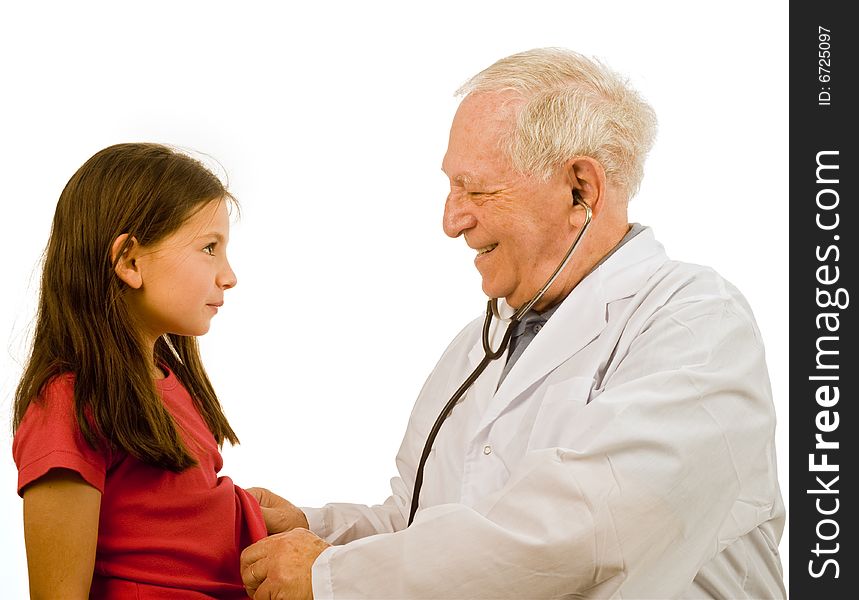 Senior doctor examining a young girl patient. Senior doctor examining a young girl patient