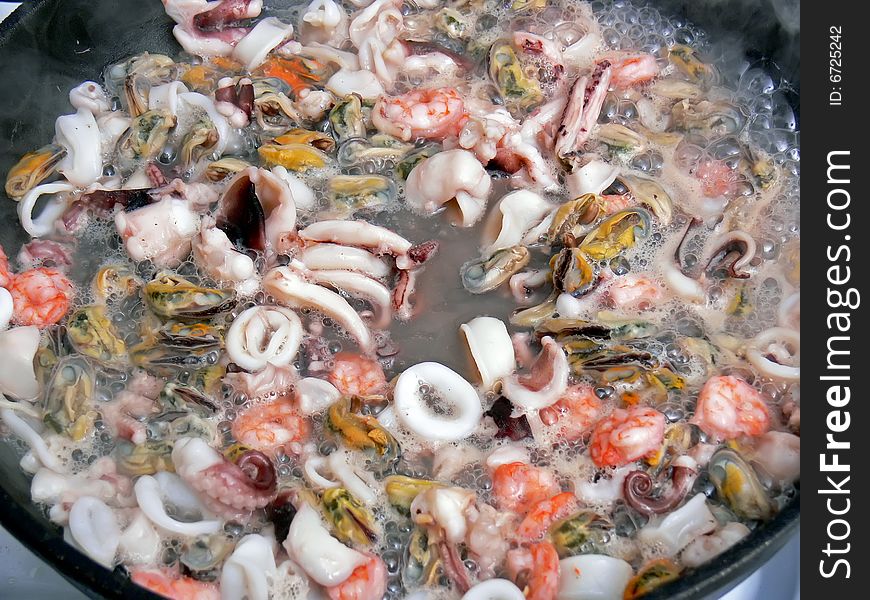 Close up of the seafood on the frying pan. Close up of the seafood on the frying pan.