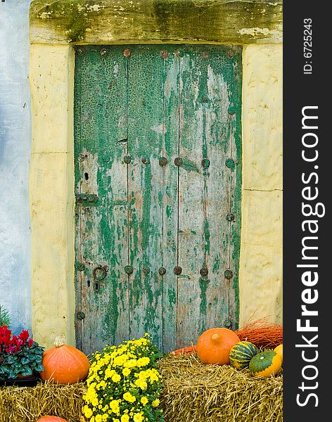 A shot of a door with autumn decoration. A shot of a door with autumn decoration