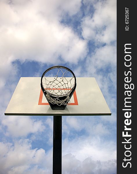 Outdoor basketball goal with sky background. Outdoor basketball goal with sky background