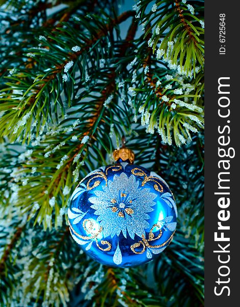 New-year tree blue decoration on green branch. New-year tree blue decoration on green branch