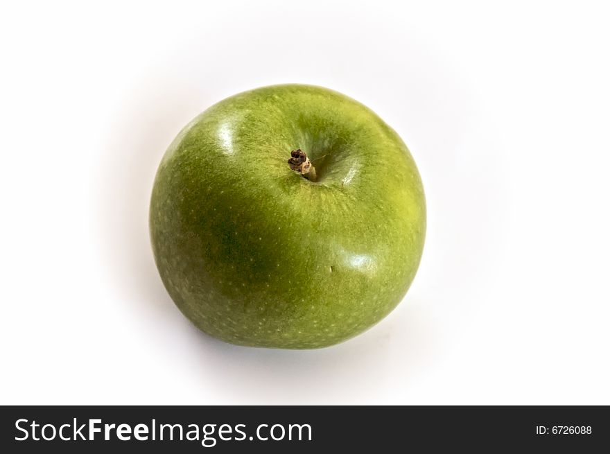 One granny smith apple seen from above