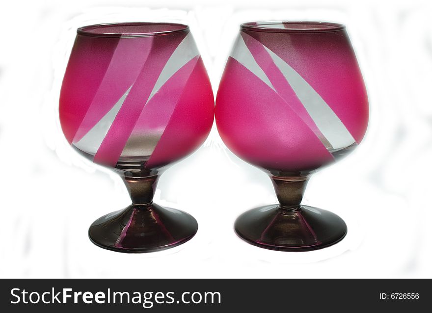 Two pink glasses on a white background