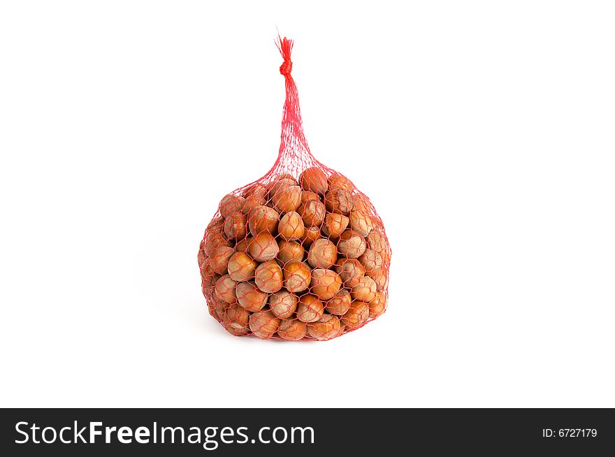 Heap of huzel- nuts isolated on a white background. Heap of huzel- nuts isolated on a white background.