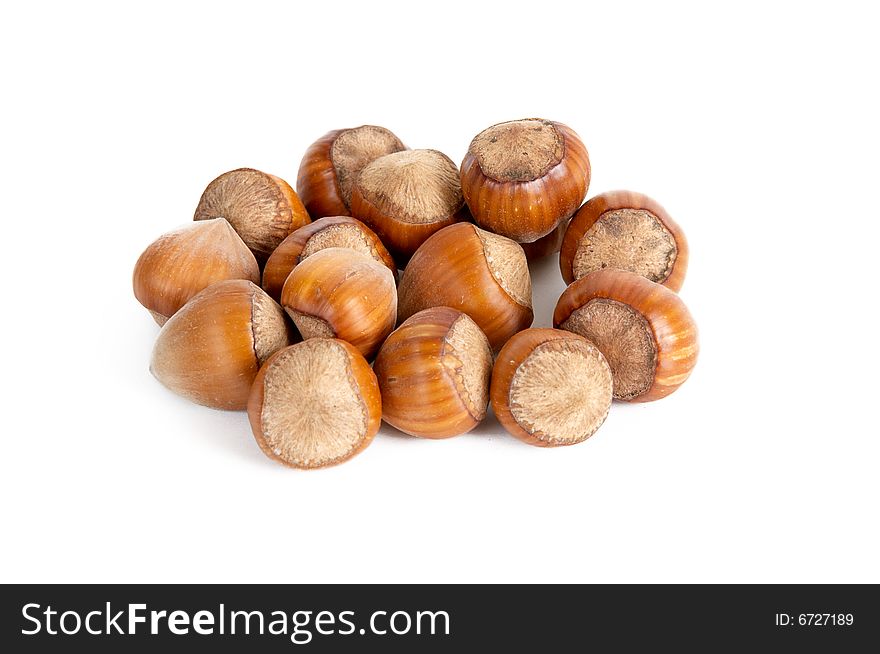 Heap of hazel-nuts isolated on a white background. Heap of hazel-nuts isolated on a white background.