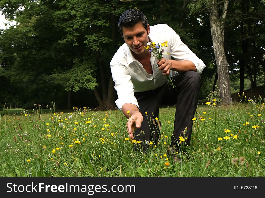 Man picking flowers for valentine. Man picking flowers for valentine
