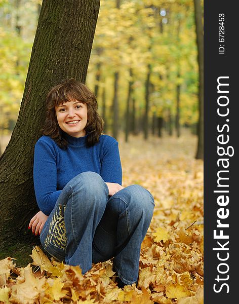 The girl on a background autumn forest