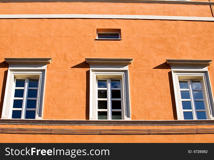 Windows on orange wall in Rome, Italy. Windows on orange wall in Rome, Italy