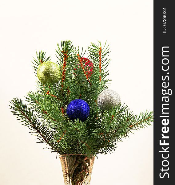 Christmas balls  with branches ate on a white background