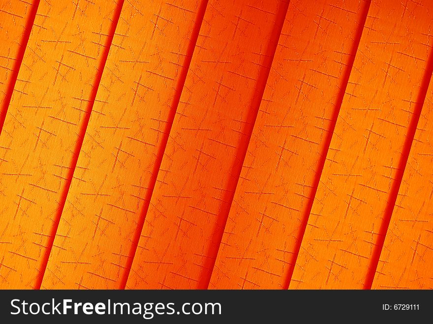 Orange background texture with red lines and dark shadows
