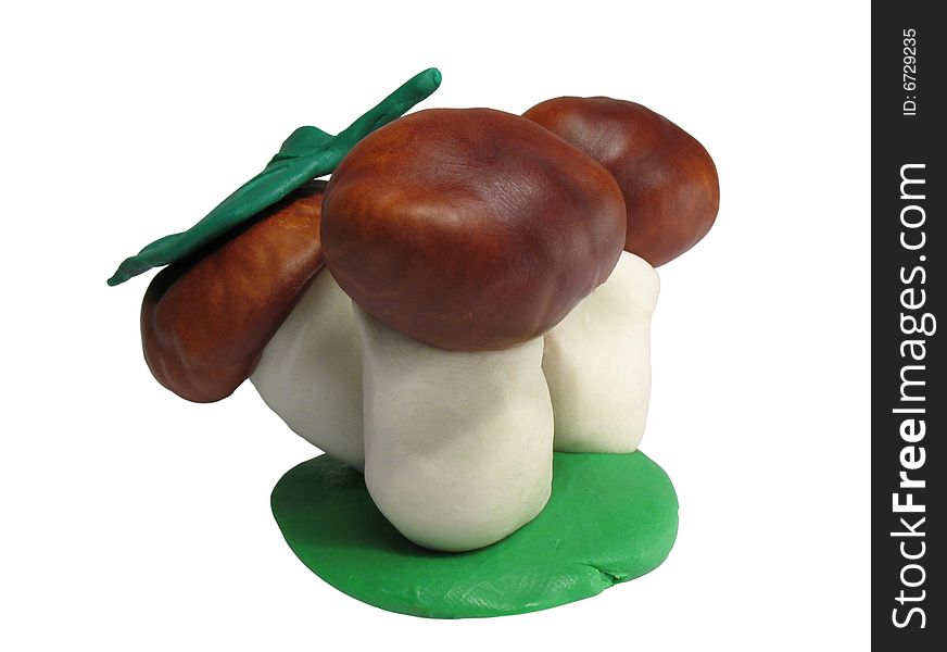 The beautiful mushrooms made the hands from plasticine and fruits of a chestnut. With clipping puths. The beautiful mushrooms made the hands from plasticine and fruits of a chestnut. With clipping puths.