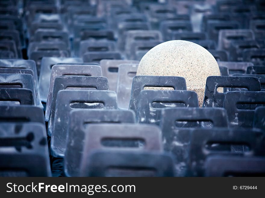 Concept pictures of empty chairs and stone post in the Vatican