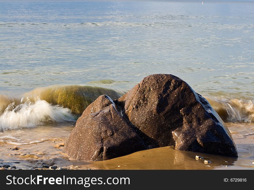 Sea coast,  rock and water with waves