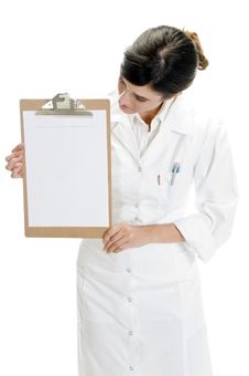 Lady Doctor Looking Paper In Writing Board Stock Image