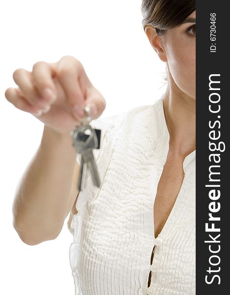 Lady with keys in her hand on an isolated white background