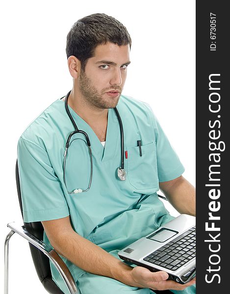 Sitting man looking you with laptop