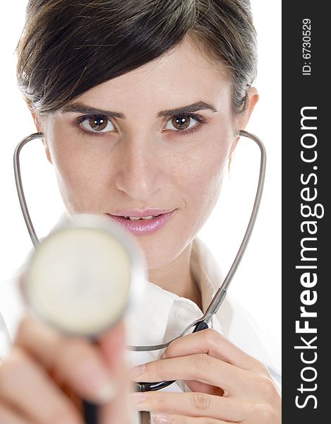 Lady doctor posing with stethoscope on an isolated background